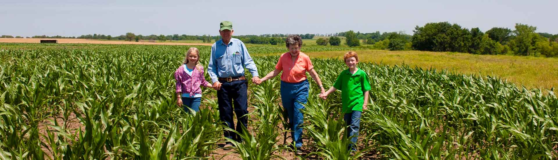 family walking thru CSA farm together in Flemington